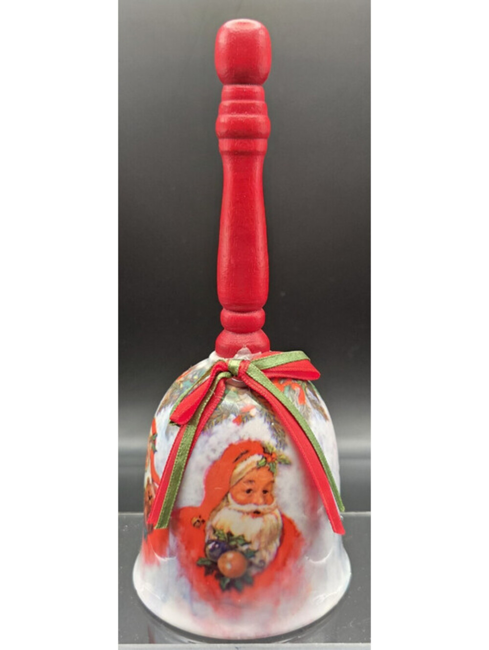 Vintage Santa Claus Christmas Porcelain Bell with a wooden handle . 7" Tall
